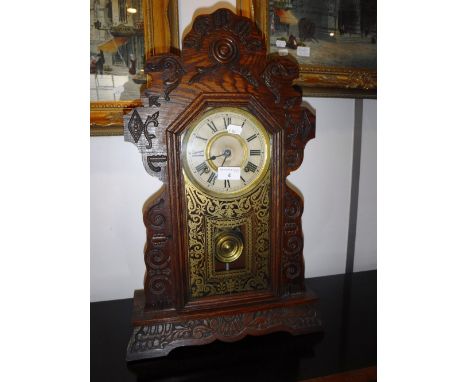 A 19TH CENTURY 'GINGERBREAD' AMERICAN MANTEL CLOCK, Made by 'The Ansonia Clock Co' 22.5" high