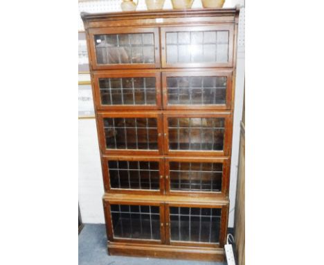 A FIVE SECTION GLOBE-WERNICKE TYPE SECTIONAL BOOKCASE with leaded glass doors, 35" wide