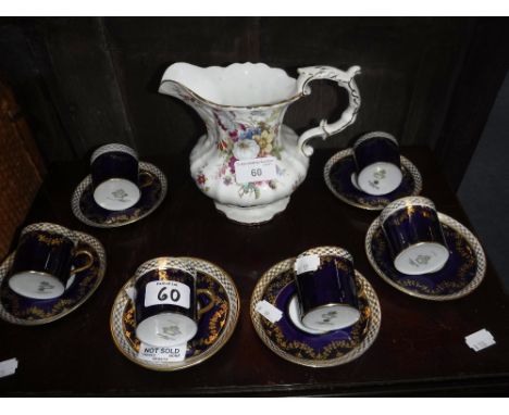 AYNSLEY: A SET OF SIX BLUE AND GILT COFFEE CANS with saucers and a Hammersley jug