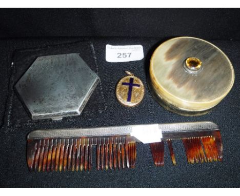 A SILVER POWDER COMPACT and similar items