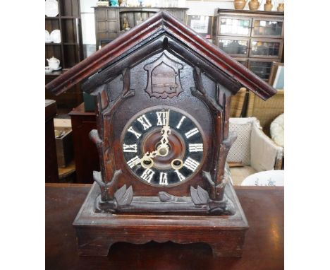 A BLACK FOREST CUCKOO MANTEL CLOCK