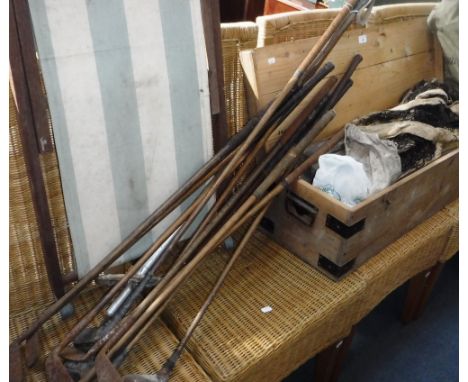 A VINTAGE TENNIS NET, in its original pine box, a collection of hickory shafted golf clubs and similar items