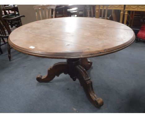 A VICTORIAN OAK BREAKFAST TABLE with moulded tripod support, 45" dia