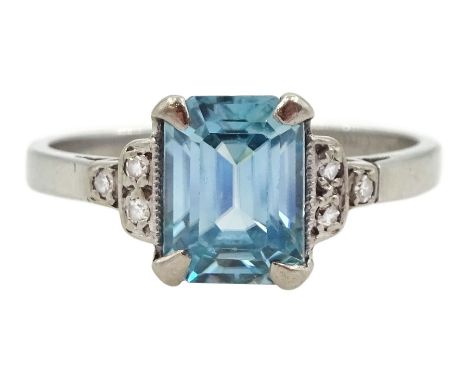 Platinum Art Deco emerald cut blue zircon ring, with three milgrain set old cut diamonds either side, stamped platinum, zirco