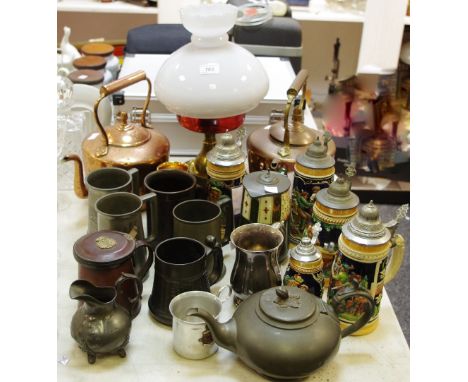 A pewter teapot by James Dixon of Sheffield; various pewter tankards; various German steins with hinged covers; an oil lamp w