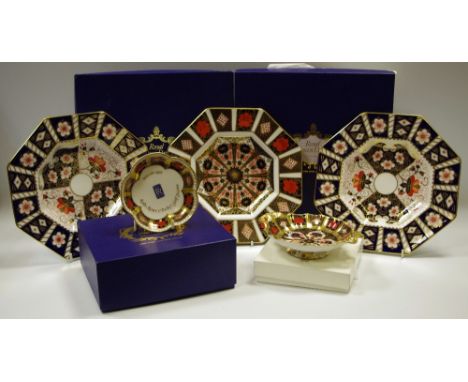 A Royal Crown Derby 1128 octagonal plate; two 2451 pattern octagonal plates; a Royal Crown Derby 1128 all gold border trinket