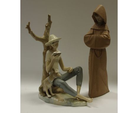 A Lladro figure of a monk; Nao boy and dog