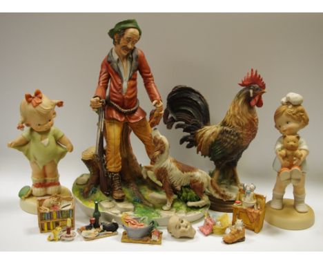 A large continental bisque porcelain figural group of the the huntsman with his dog, signed Zarella; two large bisque porcela