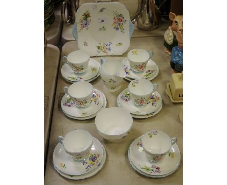 A Shelley wild flowers part tea service for six comprising cake plate, six teacups and saucers and tea plates, sucrier and mi