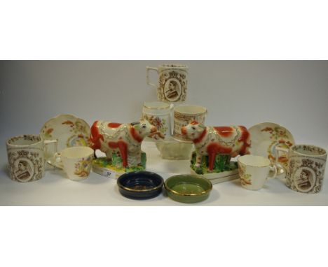 Various Queen Victoria commemorative mugs, cabinet cups and saucers; a pair of Staffordshire bull flatbacks; etc  