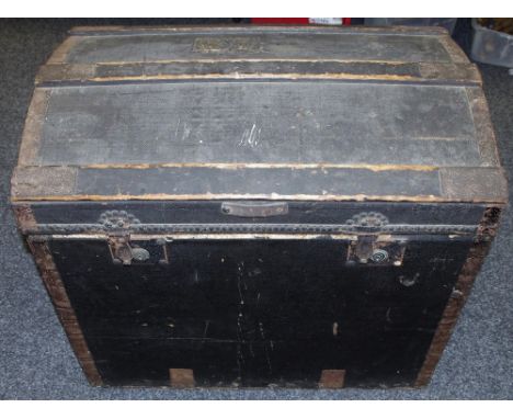 A canvas and wood bound dome top trunk Minshall Bengough label to interior