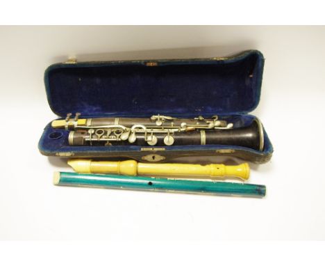 A cased clarinet Sisteme Buffet; a child's recorder; another (3)