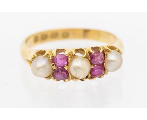 A Victorian ruby and pearl set 18ct gold ring, comprising three pearls with oval and rectangular cut rubies, width approx 6mm