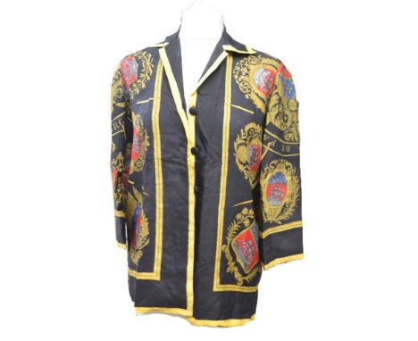 An Hermes black silk jacket from the 1950s, the centre of the jackets bears a medallion of a galleon and "Les Ar Mes De Paris