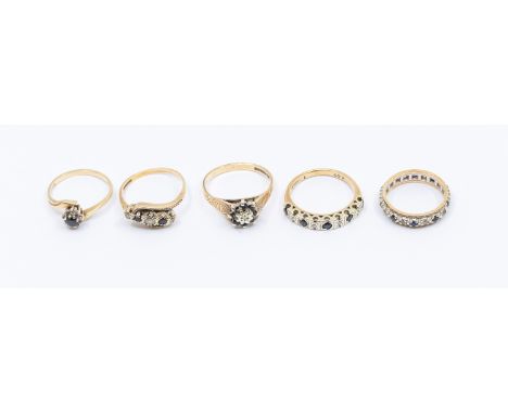 Five 9ct gold sapphire set rings, including a diamond and sapphire half eternity ring, size O, a sapphire and diamond cluster