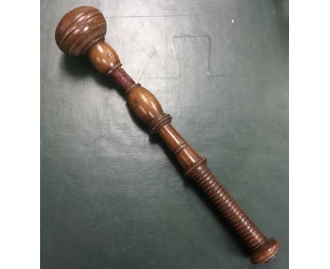 An early 19th century turned mahogany press gang cosh. Ring turned handle with wide disc pommel area. Rounded head with ring 