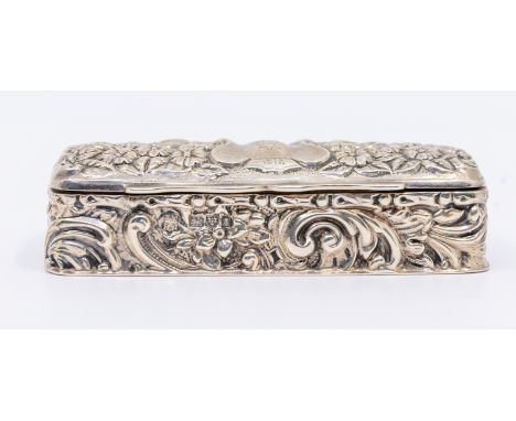 An Edwardian silver snuff box, of oblong rectangular form with elaborate floral and foliage embossed design, partially gilt i