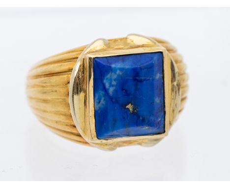 A French vintage lapis lazuli and gold ing, comprising a rub over set faceted rectangular cut lapis lazuli approx 11 x 10mm, 