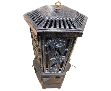 A modern freestanding electric stove made of metal and ceramic in a floral design.