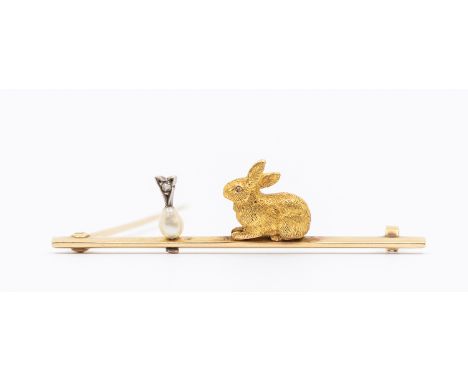A 20th century bar brooch, comprising a seated model of a a rabbit and a pearl and diamond carrot, unmarked probably 15ct gol