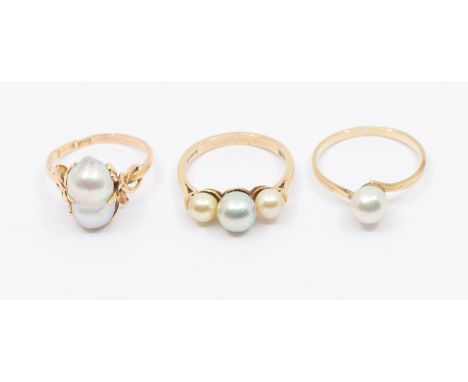 Three pearl set rings, to include a 14ct gold single grey coloured double pearl set ring, size N, total gross weight approx 3