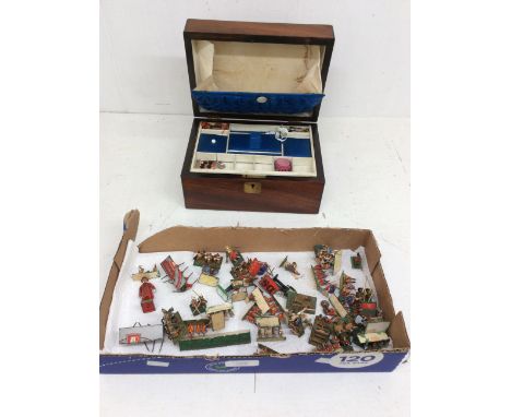 A late 19th century mahogany sewing box, having brass escutcheon and cartouche, compartments within, and some sewing related 
