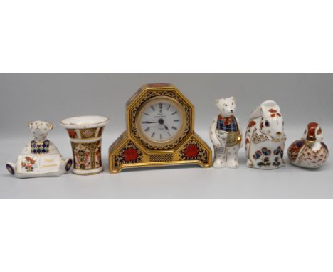 A collection of Royal Crown Derby silver and none stopper paperweights, 1128 imari mantle clock and a posie vase, AF.