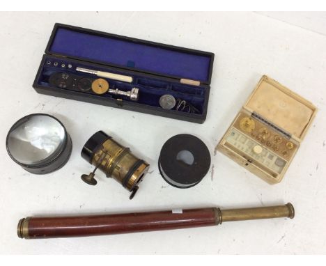 Mid 20th Century cased instruments, ivory bakalite cased weights, scientific lenses and telescope.