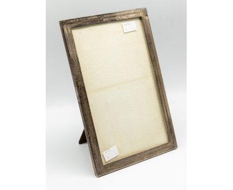 A George V engine turned silver rectangular photo frame, wooden easel back, hallmarked Birmingham, 1923, makers mark slightly