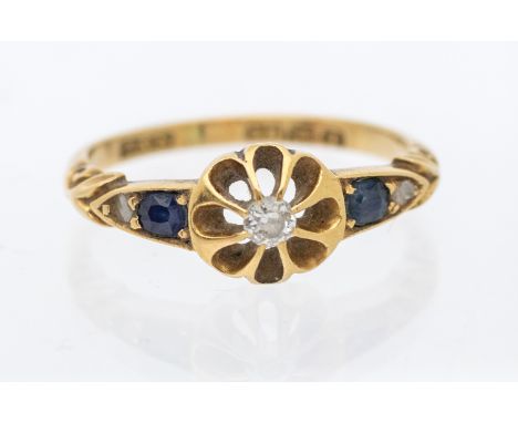 A diamond and 18ct gold ring, comprising a wirework gold daisy claw set to the centre with a diamond approx 2mm, he shoulders