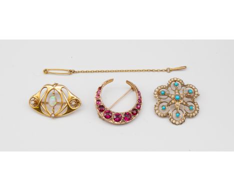 A collection of three early 20th century 9ct gold brooches, to include a crescent brooch, set with round mixed cut tourmaline