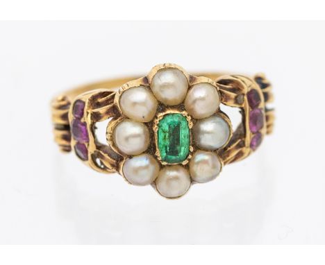 A late Georgian/early Victorian pearl, emerald, ruby set gold ring, comprising a floral motif set to the centre with an oval 