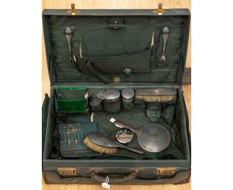 A Finnigans of Manchester vanity cased set, green leather and green fabric interior, with accompanying engine turned silver c