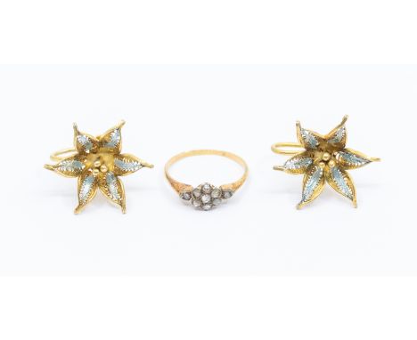 An early 20th century diamond set gold cluster ring, comprising a small daisy shaped mount set with rose cut diamonds, width 