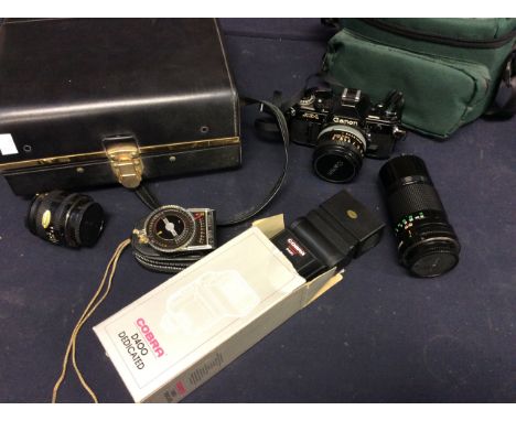  Canon AE-1 '1086952' camera with Canon '11404' lens (200mm); 3 Hoya close-up and 2 lens; Cobra D400 flash meter; wide angle 