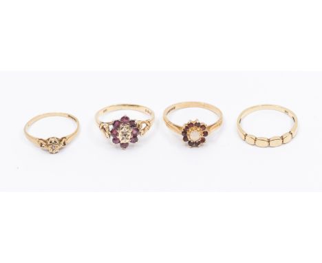 A collection of our 9ct rings, comprising three stone set rings including a ruby and diamond cluster, (one stone replaced wit