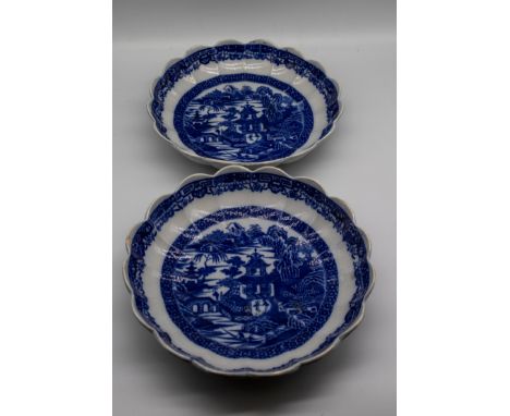 Two 19th century Spode blue and white transfer-printed shallow dishes with a scalloped and fluted rim, printed with Chinese l