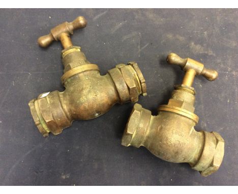 A pair of large pipe junction taps, brass, heavy duty.