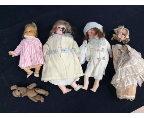 A collection of early 20th Century bisque head dolls along with mid 20th Century dolls, AF.