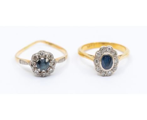 A sapphire and diamond cluster ring, comprising an oval sapphire within a diamond set border, size J1/2, (shank worn at an an