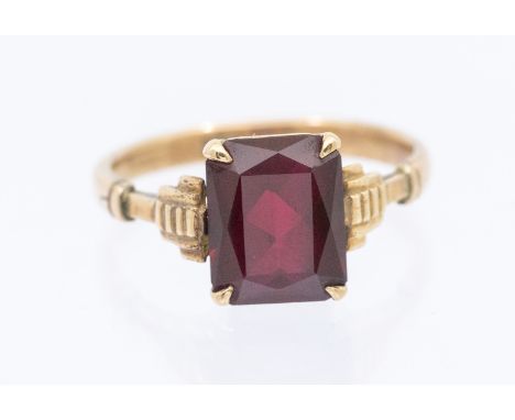 A synthetic ruby set 9ct gold single stone ring, set with a rectangular cut stone, size Q, total gross weight approx 3gms  Fu