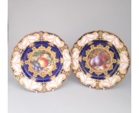 Two Royal Worcester Dessert plates, painted with fruit. One painted with apples, grapes and red berries, the other painted wi