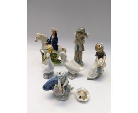 A collection of four Nao figures along with Lladro figure and a Staffordshire figure of Tom King, 1 Nao figure damaged