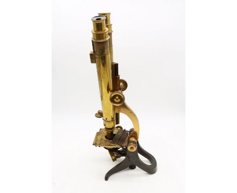 A fine 19th Century binocular brass microscope in good condition in mahogany case, great for display, rare in style.
