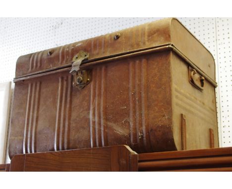 A dome topped metal trunk.