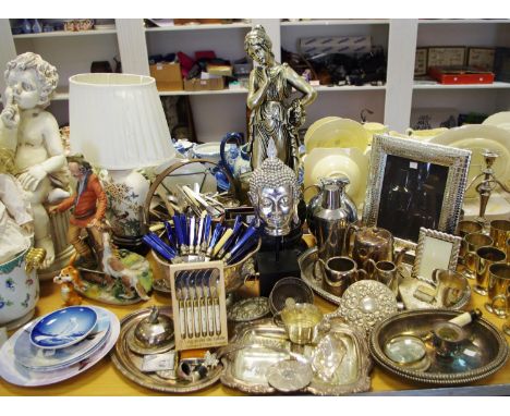 A substantial silver plated scale effect photograph frame, another smaller photograph frame; Buddha on a plinth; a Victorian 