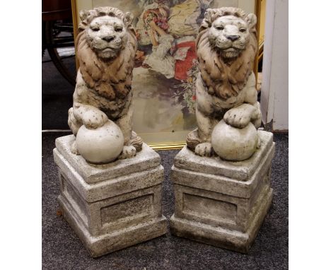 A pair of reconstituted gate post finials as seated lion 