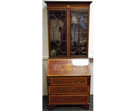 A Sheraton revival bureau bookcase, stepped cornice, astragal glazed doors enclosing shelving to top, fall front enclosing fi