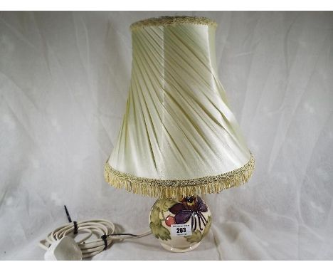 A Moorcroft Pottery lamp base decorated with Columbine on an ivorine ground, with shade - Est £70 - £100