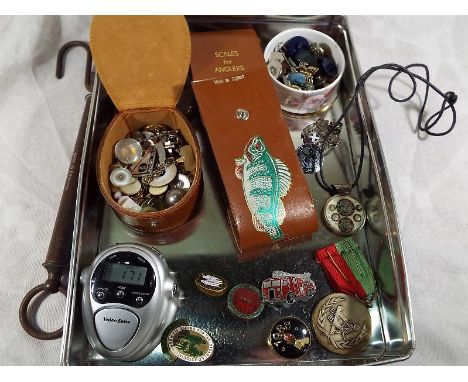 A good mixed lot to include buttons, cuff links, medallions, pin badges, anglers scales, Voice Zone pedometer and similar.